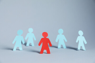 Many human paper figures on light background