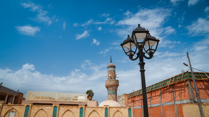Beautiful architecture and historic mosque tower in Baghdad Iraq under a clear sky