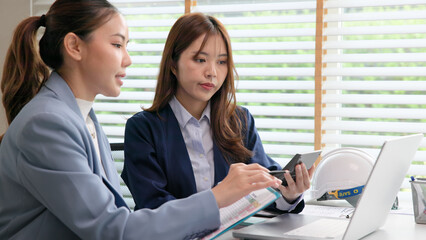 Expert woman asian people discuss review data number costing managerial account prepare monthly...