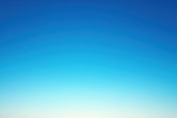 Clear blue sky gradient from light to deep blue with no clouds or objects visible.