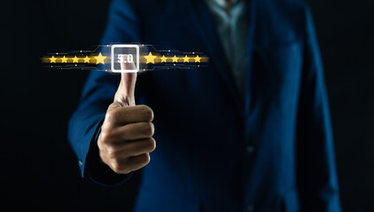 A person in a suit gives a thumbs-up while selecting a five-star rating on a digital interface.