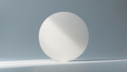 A white sphere on a reflective surface against a plain background.