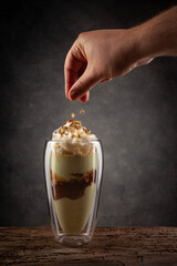 Avocado latte with a hand