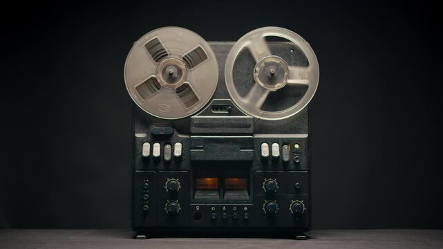 Tape audio music player, studio magnetic tape, vintage retro spool reel to reel player and recorder, magnetic tape data storage close up, music studio. 
