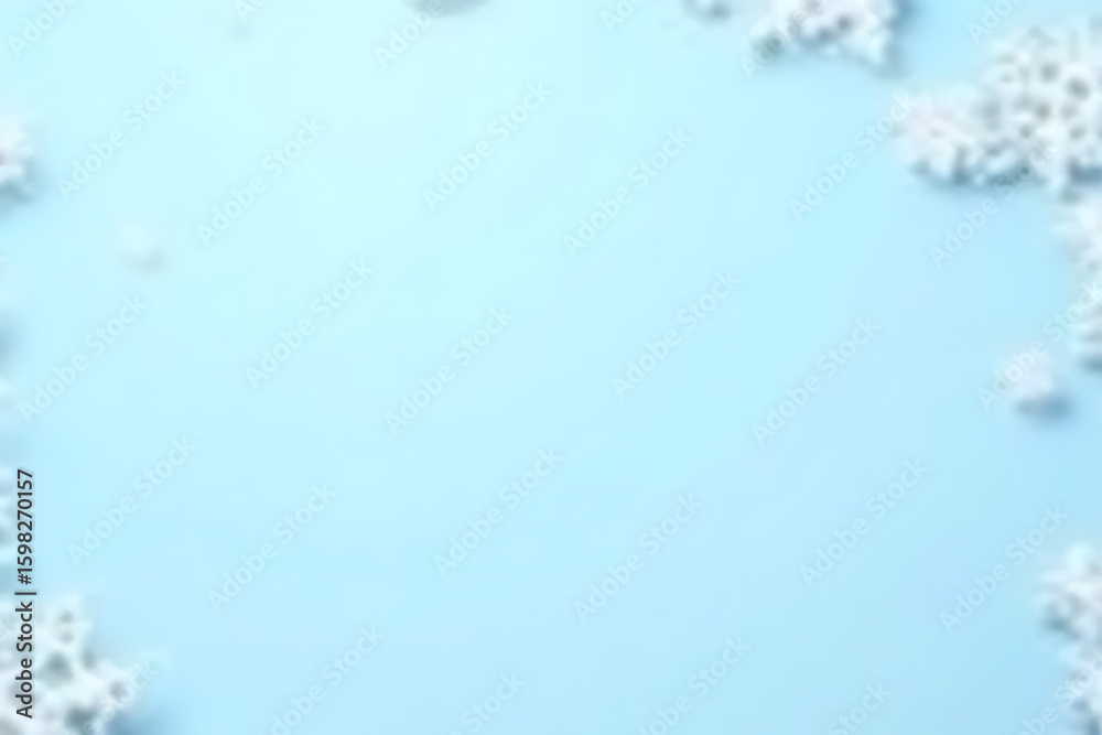 Poster light blue background with white snowflake shapes arranged around the edges creating a wintery borde