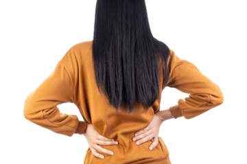 Rear view of a woman suffering from lower back pain, holding her aching back. Concept for muscle injury, lumbar strain, and health problems isolated on white background with clipping path.