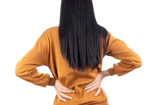 Rear view of a woman suffering from lower back pain, holding her aching back. Concept for muscle injury, lumbar strain, and health problems isolated on white background with clipping path.