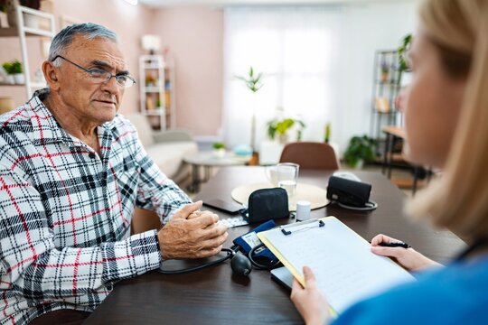 Senior gentleman discusses health concerns with doctor