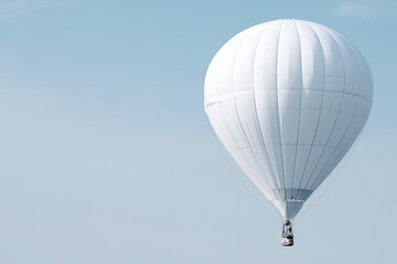 Fototapeta premium White Hot Air Balloon Against A Light Blue Sky