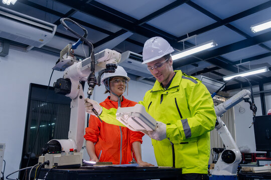 Engineers collaborate on robotic technology in a modern laboratory setting during a training session