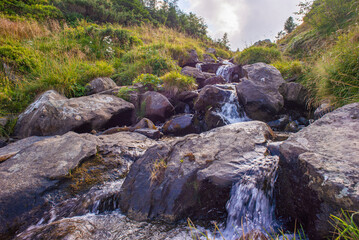 mountain waterfall stream among large stones