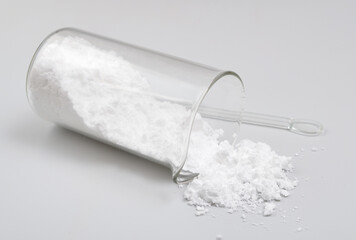 Creatine Powder on light grey background