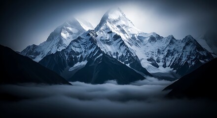 Obraz premium Majestic snow capped mountains emerging from a sea of clouds