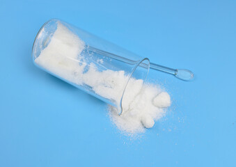 Metronidazole powder on blue background