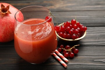 Superfood. Tasty smoothie in glass and ingredients on wooden table, closeup