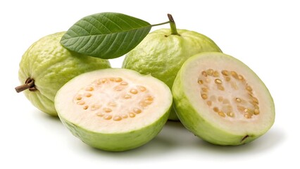 Whole and halved light green guavas with leaf fruit