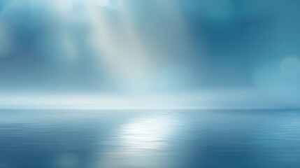 Obraz premium Tranquil blue horizon reflecting soft light, evoking a serene mood over calm waters, perfect for relaxation themes.