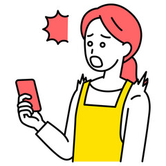 スマートフォンの画面を見て驚くエプロン姿の女性