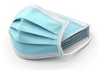 A stack of folded blue medical face masks with white ear loops isolated on a white background