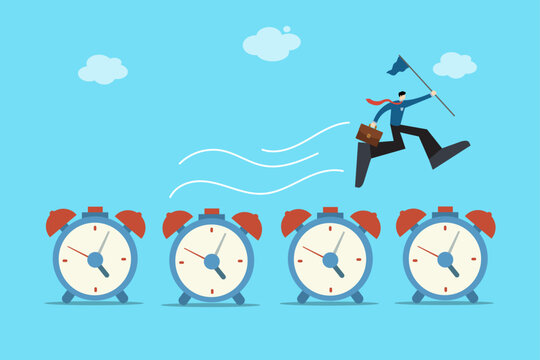 Businessman jumping over multiple alarm clocks holding a flag, symbolizing success, achievement, and beating deadlines.