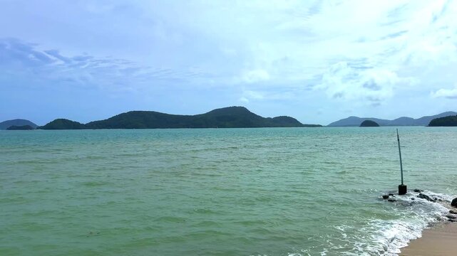 Beautiful view from Kao Khad next to Cape Panwa on the island of Phuket Thailand. Views of the turquoise Blue waters of the Andaman Sea and small islands off the coat of Phuket