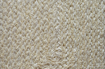 Close up detail of straw hat texture background. Natural woven fabric.
