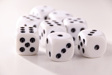 A random arrangement of dice and a puzzle cup, captured after the dice have been cast.