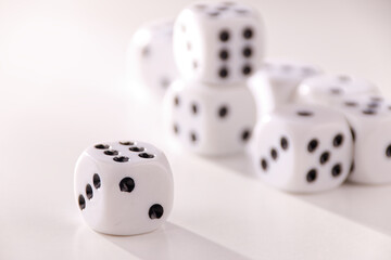 A random arrangement of dice and a puzzle cup, captured after the dice have been cast.