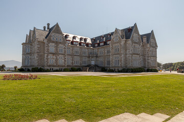 Santander, Spain. Spring view of the Palacio de la Magdalena with its grand facade, lush green...