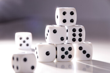 A random arrangement of dice and a puzzle cup, captured after the dice have been cast.