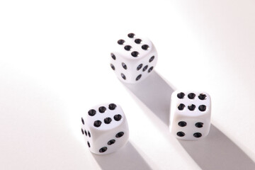 A random arrangement of dice and a puzzle cup, captured after the dice have been cast.