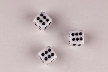 A random arrangement of dice and a puzzle cup, captured after the dice have been cast.