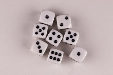 A random arrangement of dice and a puzzle cup, captured after the dice have been cast.