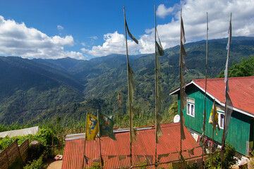 Homestay at Okhrey village, Himalayan mountain range in the background . Okhrey is a remote village with scenic natural vista in Sikkim, India. Many homestays are available for tourists from all over.