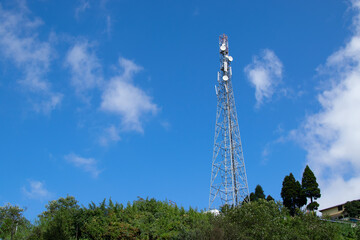 Mobile tower at Okhrey village. Okhrey is a remote village with breath taking scenic natural vista of world famous Himalayan Mountains, in Sikkim, India.