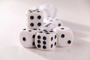 A random arrangement of dice and a puzzle cup, captured after the dice have been cast.