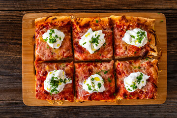 Pizza al metro margherita with burrata cheese on wooden table