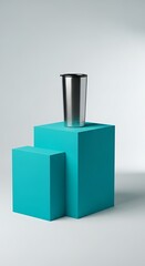 Minimalist Product Still Life: Stainless Steel Tumbler on Teal Cubes
