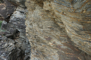 Natural cliff surface of gneiss rock. Gneiss rock texture.      
