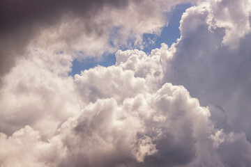 Clouds close-up in soft pastel tones of sunlight, inside the cloud close-up, light on clouds in the sky during cloudy weather, cloudy landscape, cloudy background.