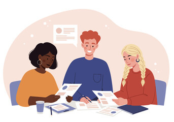 Three diverse individuals collaborating at a table, reviewing documents and discussing ideas together.