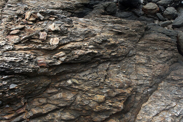 Detail of natural rock structure. Stone background. Gneiss rock texture.	