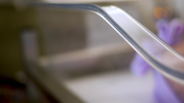 Camera Slides Across Newborn Baby in Hospital Cart - ALT