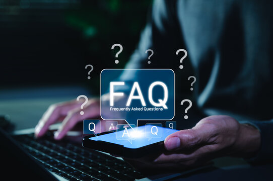 FAQ Frequently Asked Questions Digital Concept. Man holding smartphone with glowing FAQ icon above screen, symbolizing digital frequently asked questions for support, help, and information services.