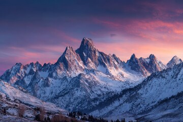 Fototapeta premium Snowy Mountain Peaks At Sunset. For travel ads, nature blogs, wallpaper