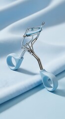 Serene Blue Eyelash Curler: Minimalist Product Shot
