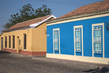 Fototapeta premium Sometimes modern and thriving, sometimes rural and colonial, houses made from the same land still prevail, as well as the modern use of concrete.