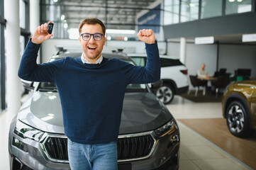 Man buying a car at a showroom