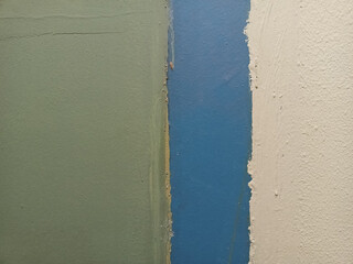 Rough gloomy wall, painted with three colors, good for backdrops, industrial themes, collages. Photo.