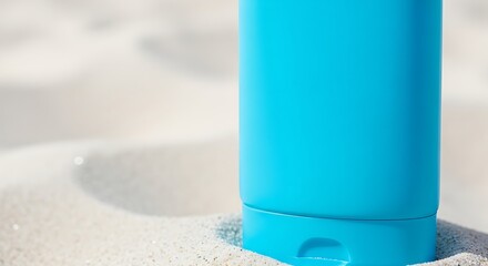Turquoise Sunscreen Bottle on Sandy Beach, Summer Protection